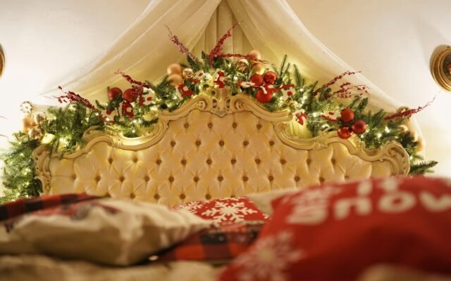 Bed canopy decorated with warm fairy lights