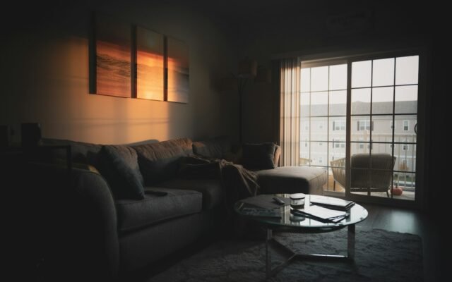 Living room with sofa and warm evening lighting