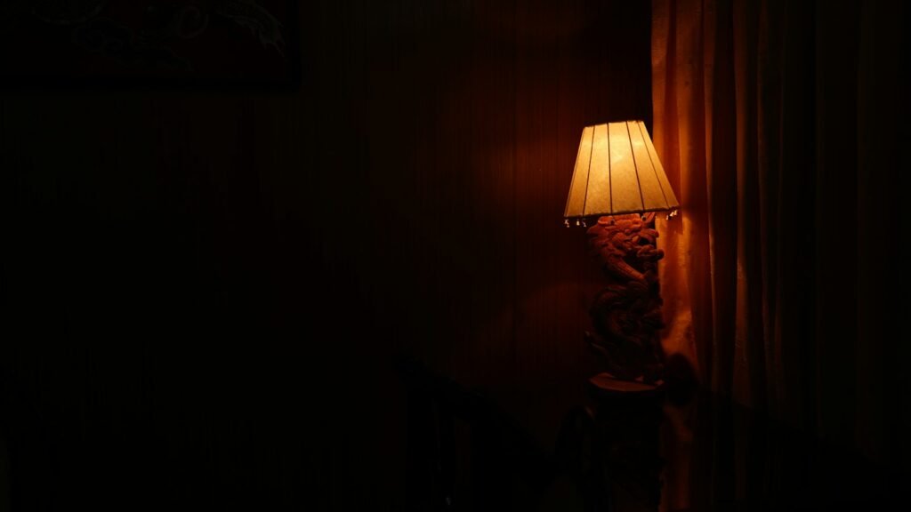 Warm lamp glowing in a dim room